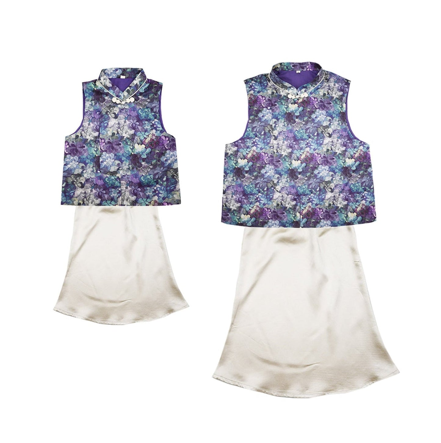 Two floral-patterned vests with white skirts on a white background