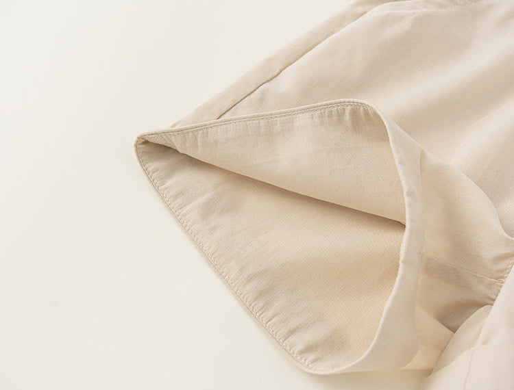 Close-up of beige fabric with a soft texture on a light background