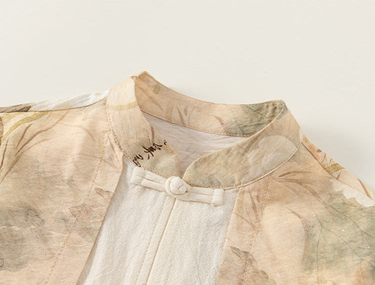 Traditional Chinese garment with floral patterns on a plain background