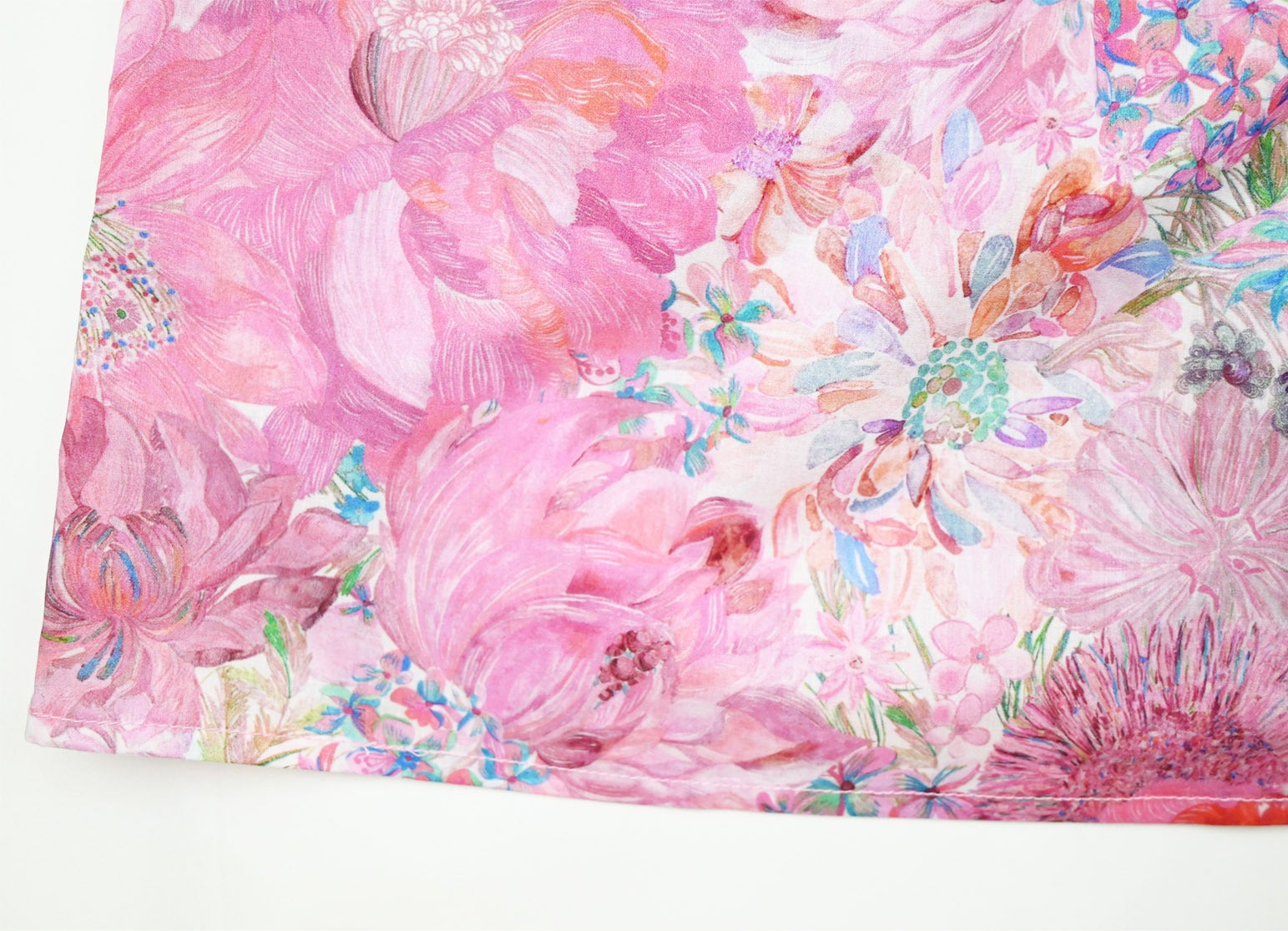 Floral fabric with pink and multicolor flowers on a white background