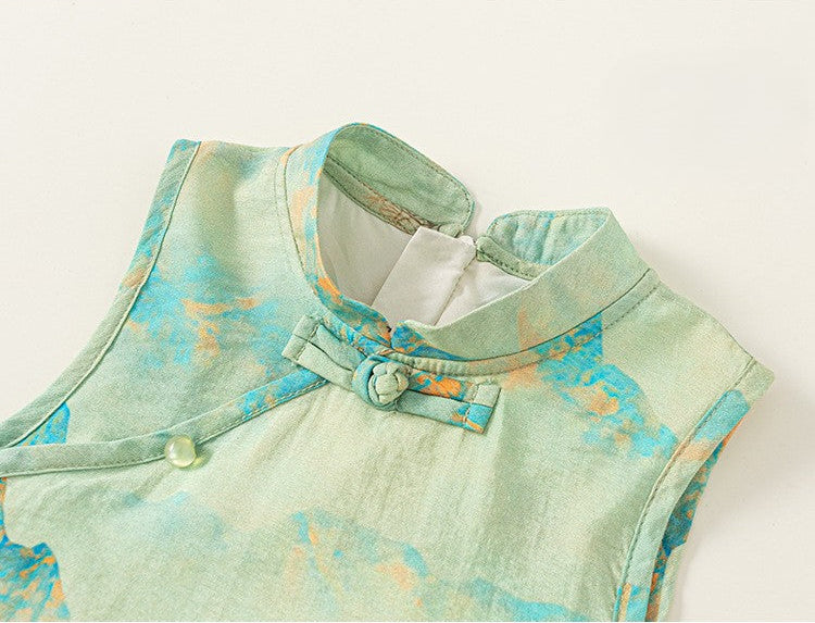 Light green sleeveless top with floral pattern on a white background