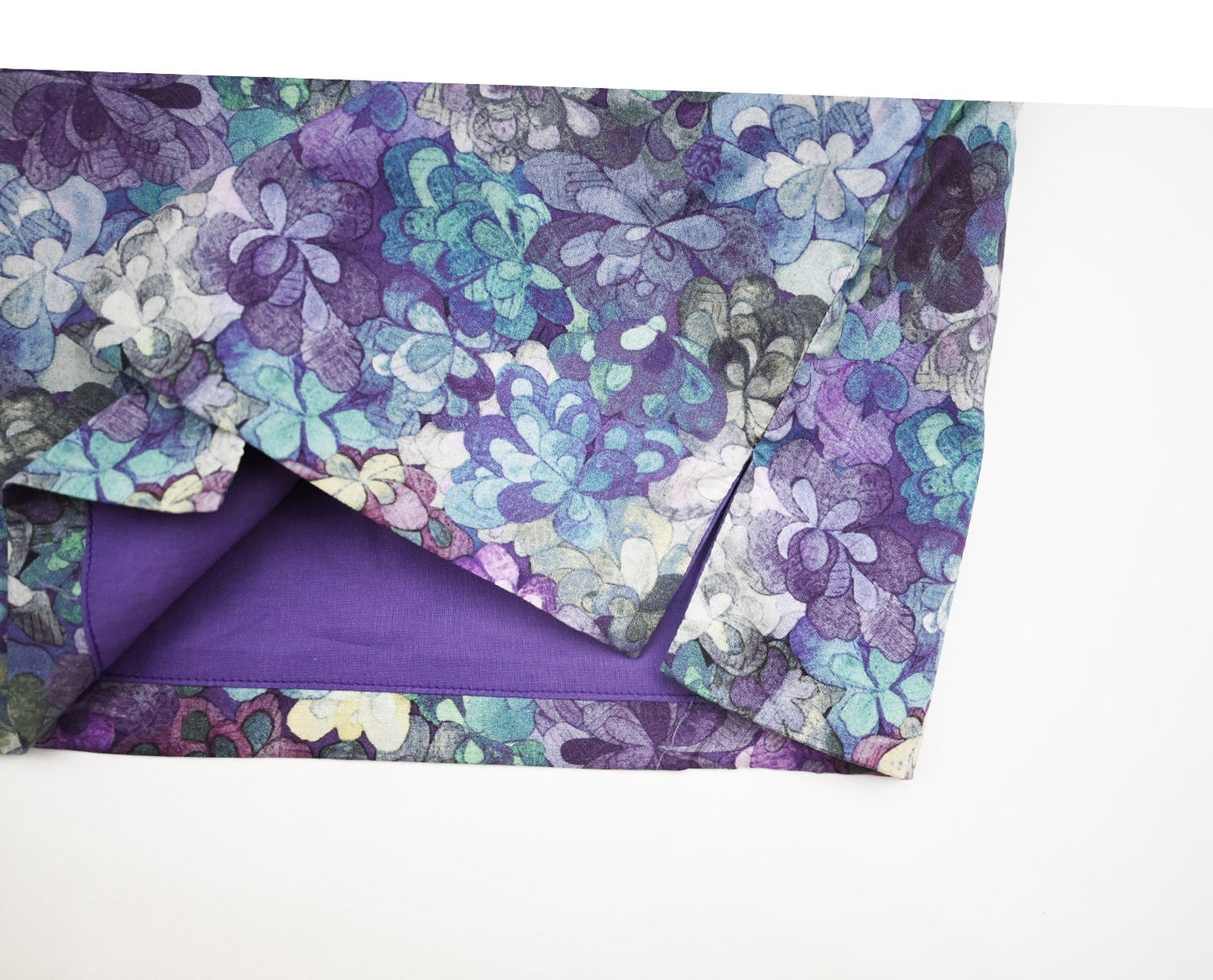 Floral-patterned fabric with a purple background