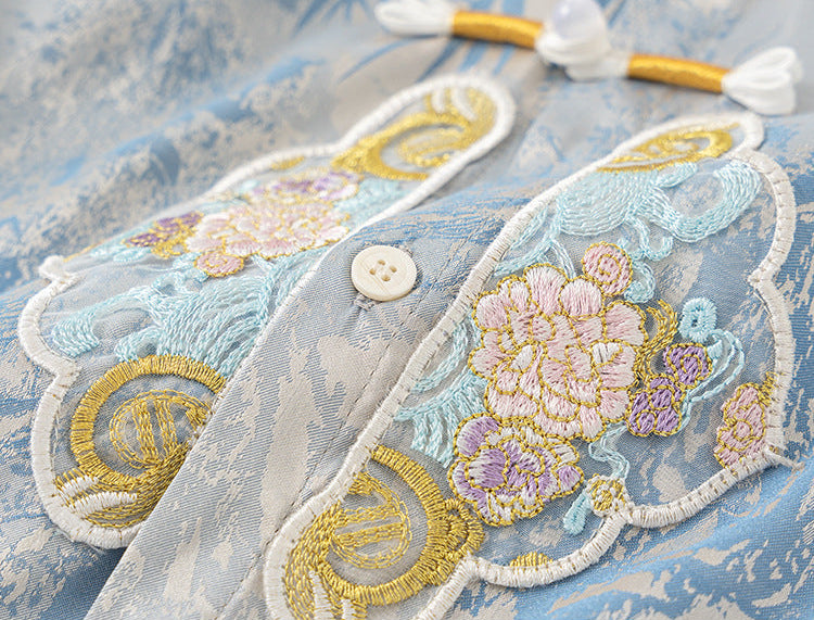 Decorative fabric patch with floral embroidery on a textured surface