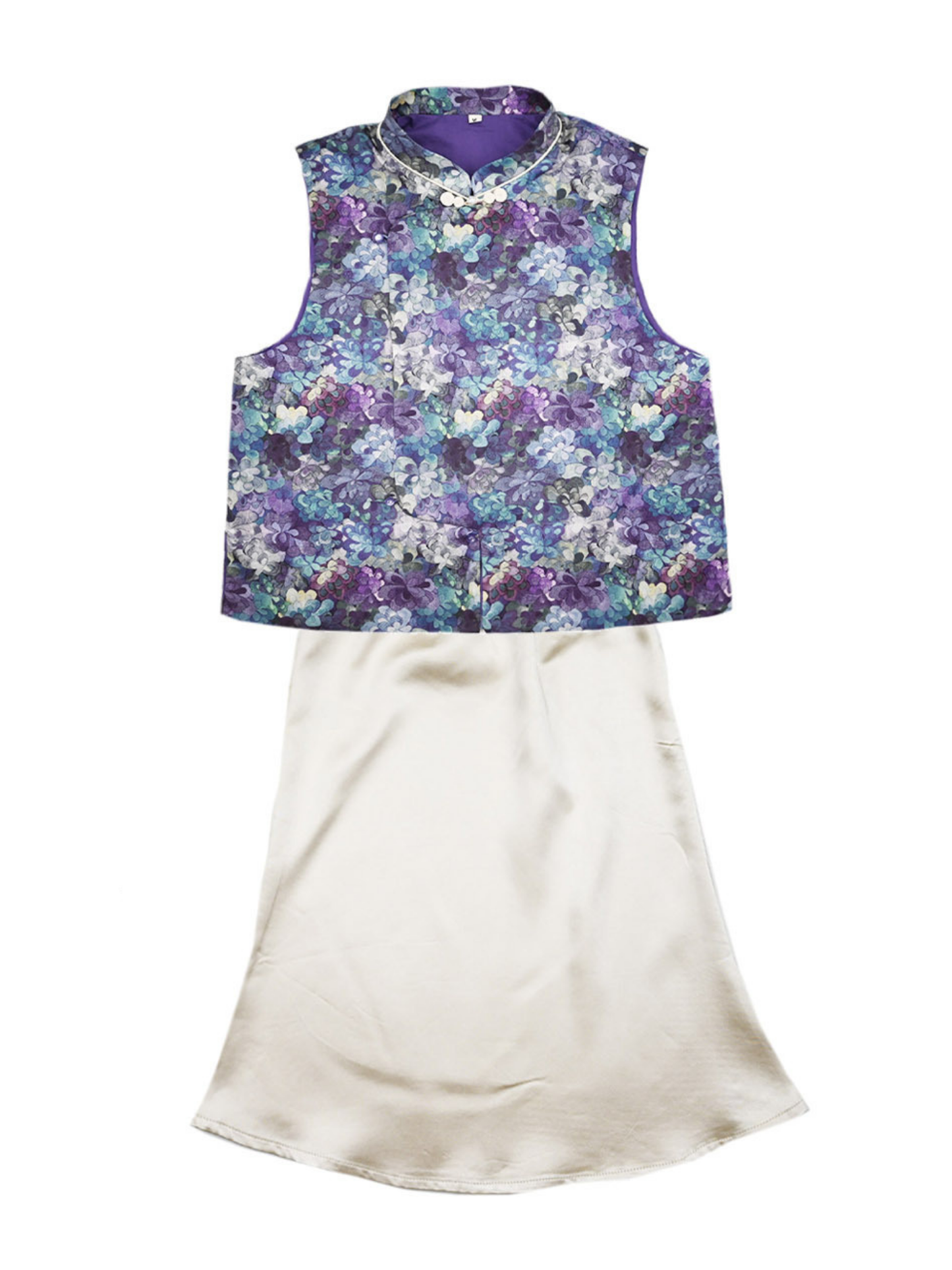 Floral-patterned sleeveless top and white skirt on a white background