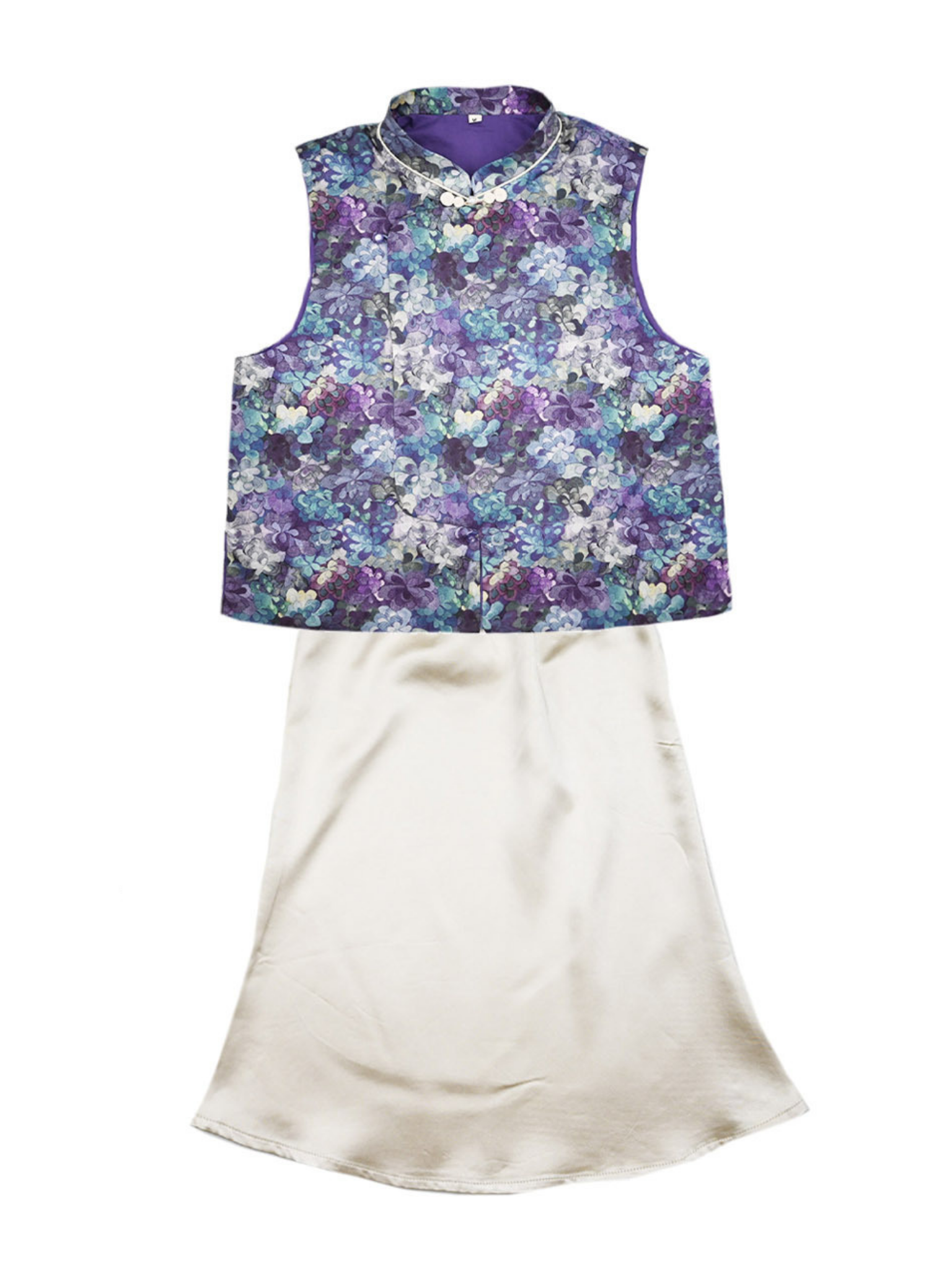 Floral-patterned sleeveless top and white skirt on a white background